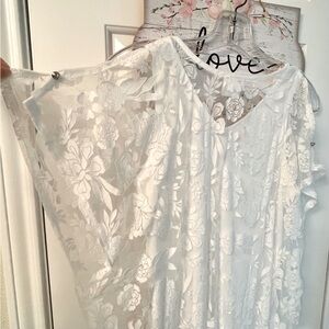 White sheer lace top with cold shoulders , lining and gold buttons.